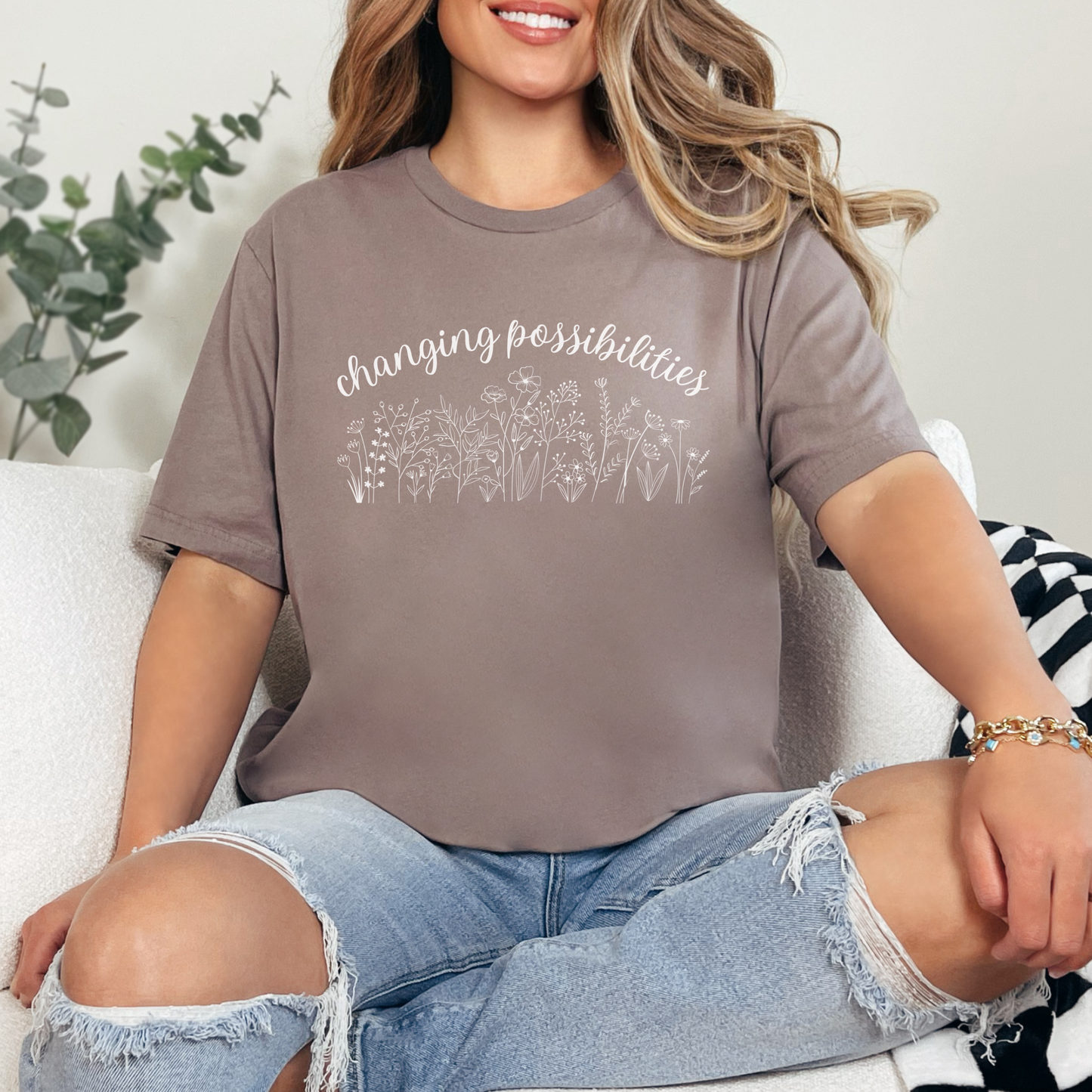 The front of this tshirt has the empowering words Changing Possibilities over a beautiful wildflower design. This tee celebrates advocates who are changing the world. Join the movement to change possibilities and create a culture of empowerment.