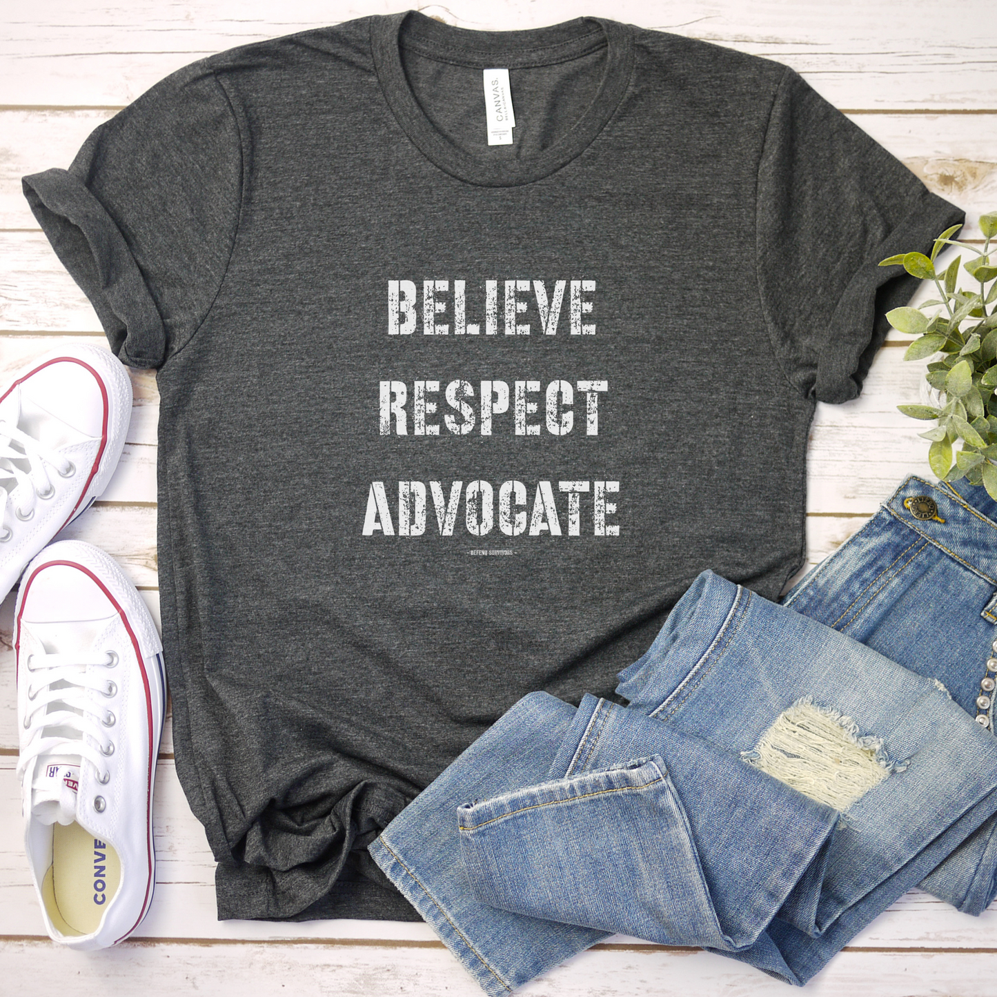 The front of this tshirt has the empowering words Believe Respect Advocate in a bold distressed font. Created for survivors of trauma and abuse, as well as mental health advocates who believe in fostering respect and supporting survivors