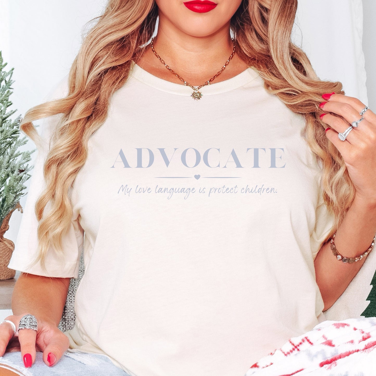 Front and center, the bold message declares, "ADVOCATE: my love language is protect children." This impactful phrase encapsulates the essence of your commitment to safeguarding children and promoting their well-being. Perfect for child advocates, champions of children’s mental health, and for Child Abuse Awareness and Prevention Month