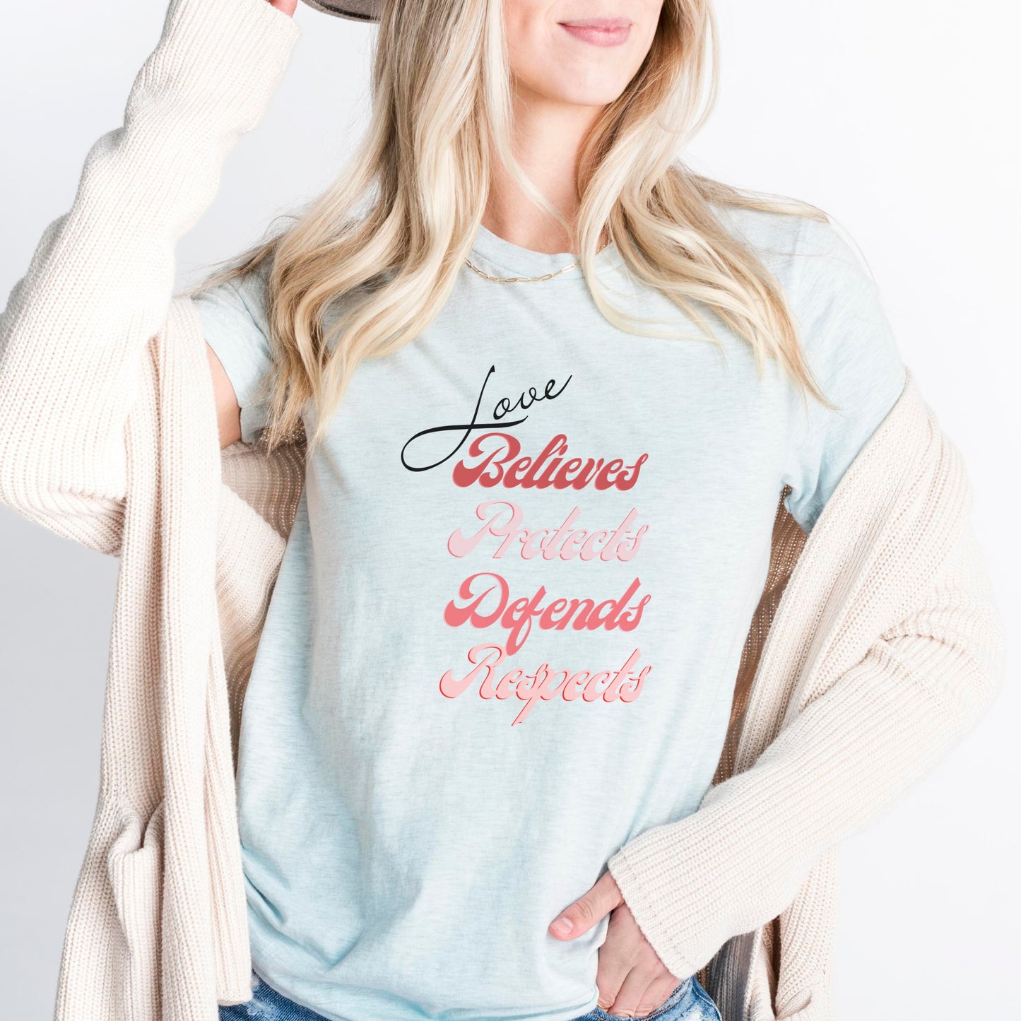 The front of this tshirt has the impactful phrase, "Love Believes Protects Defends Respects," artfully displayed in a beautiful retro font, capturing attention while spreading a message of compassion, strength, and support. Crafted with care and commitment, this tee combines a powerful message with a touch of retro elegance.