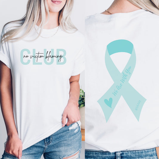 Club is on the front in bold teal letters with the phrase “No Victim Blaming” written over it in black or white. The back has a SAAM teal awareness ribbon with the words “We Are With You #SAAM” with a teal heart. Be a walking ambassador for awareness and change. Perfect For Sexual Assault Awareness Month and Denim Day.