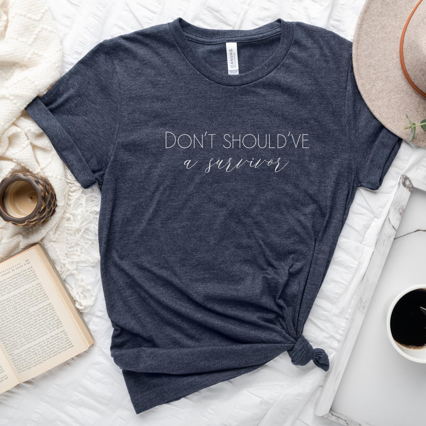 The bold and impactful slogan, "Don't Should've A Survivor," sends a clear message against the harmful practice of victim blaming. By wearing this shirt, you become an advocate for change, contributing to a culture of empathy, understanding, and respect. Perfect for survivors of abuse and trauma, victim advocates, and mental health advocates.