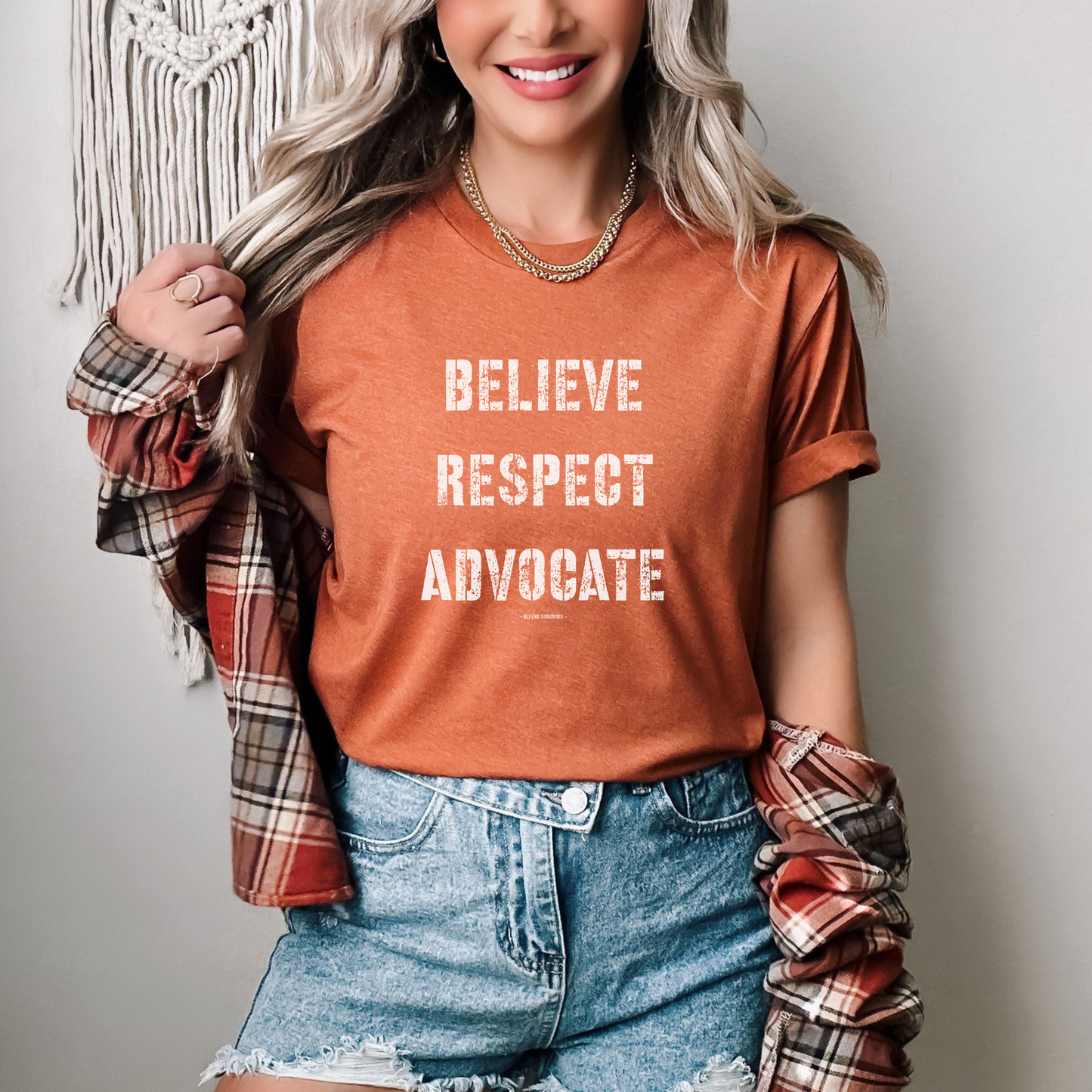 The front of this tshirt has the empowering words Believe Respect Advocate in a bold distressed font. Created for survivors of trauma and abuse, as well as mental health advocates who believe in fostering respect and supporting survivors