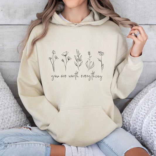 Adorned with beautiful wildflowers graphic and the empowering affirmation message You Are Worth Everything, this Tshirt is a wearable reminder of your inherent value worth and uniqueness.