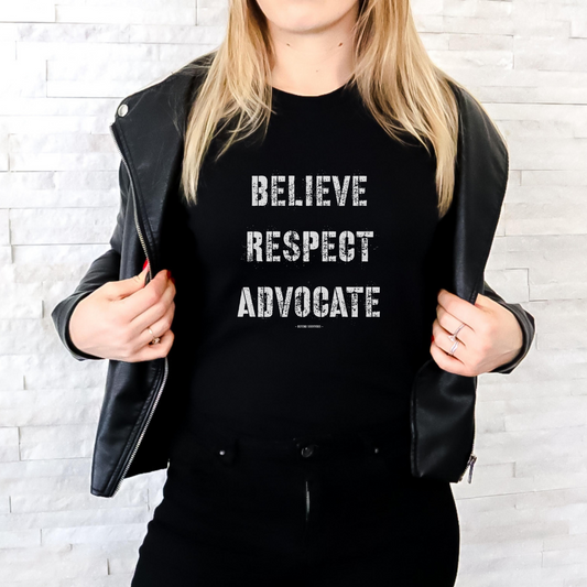 The front of this tshirt has the empowering words Believe Respect Advocate in a bold distressed font. Created for survivors of trauma and abuse, as well as mental health advocates who believe in fostering respect and supporting survivors
