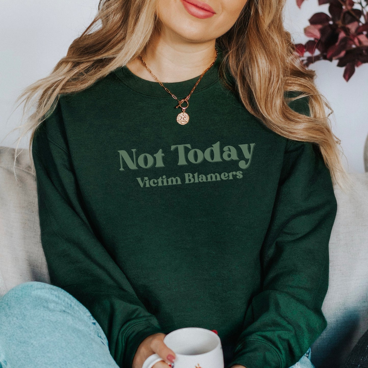 The front of the sweatshirt proudly displays the phrase "Not Today Victim Blamers" in a bold and eye-catching font. This message serves as a reminder that we reject victim-blaming and support those who have faced injustice.