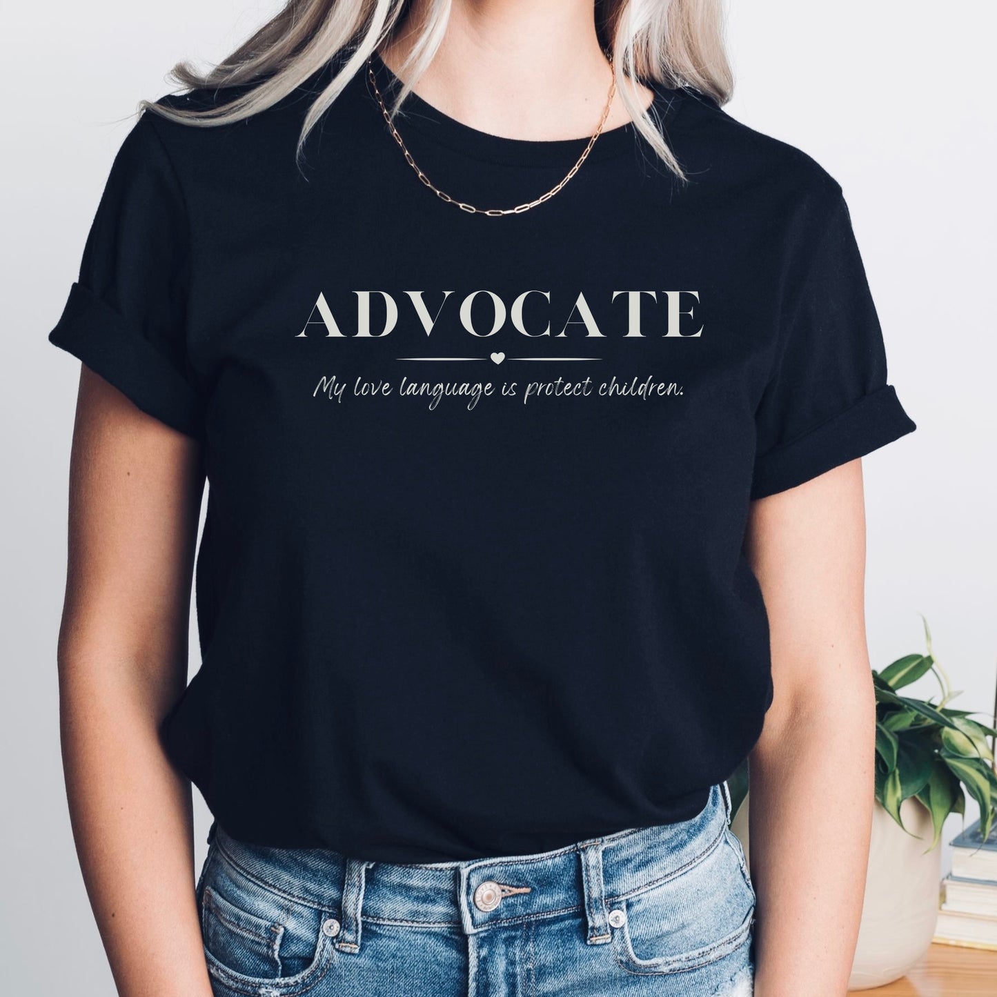Front and center, the bold message declares, "ADVOCATE: my love language is protect children." This impactful phrase encapsulates the essence of your commitment to safeguarding children and promoting their well-being. Perfect for child advocates, champions of children’s mental health, and for Child Abuse Awareness and Prevention Month