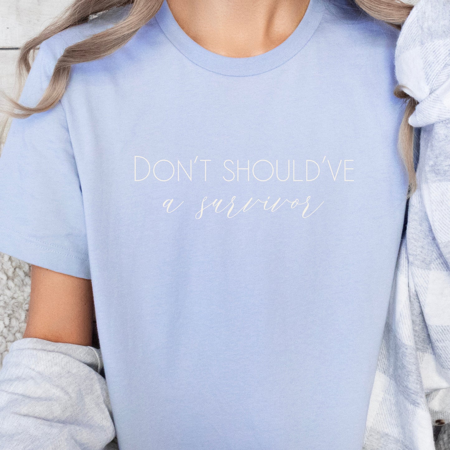 The bold and impactful slogan, "Don't Should've A Survivor," sends a clear message against the harmful practice of victim blaming. By wearing this shirt, you become an advocate for change, contributing to a culture of empathy, understanding, and respect. Perfect for survivors of abuse and trauma, victim advocates, and mental health advocates.