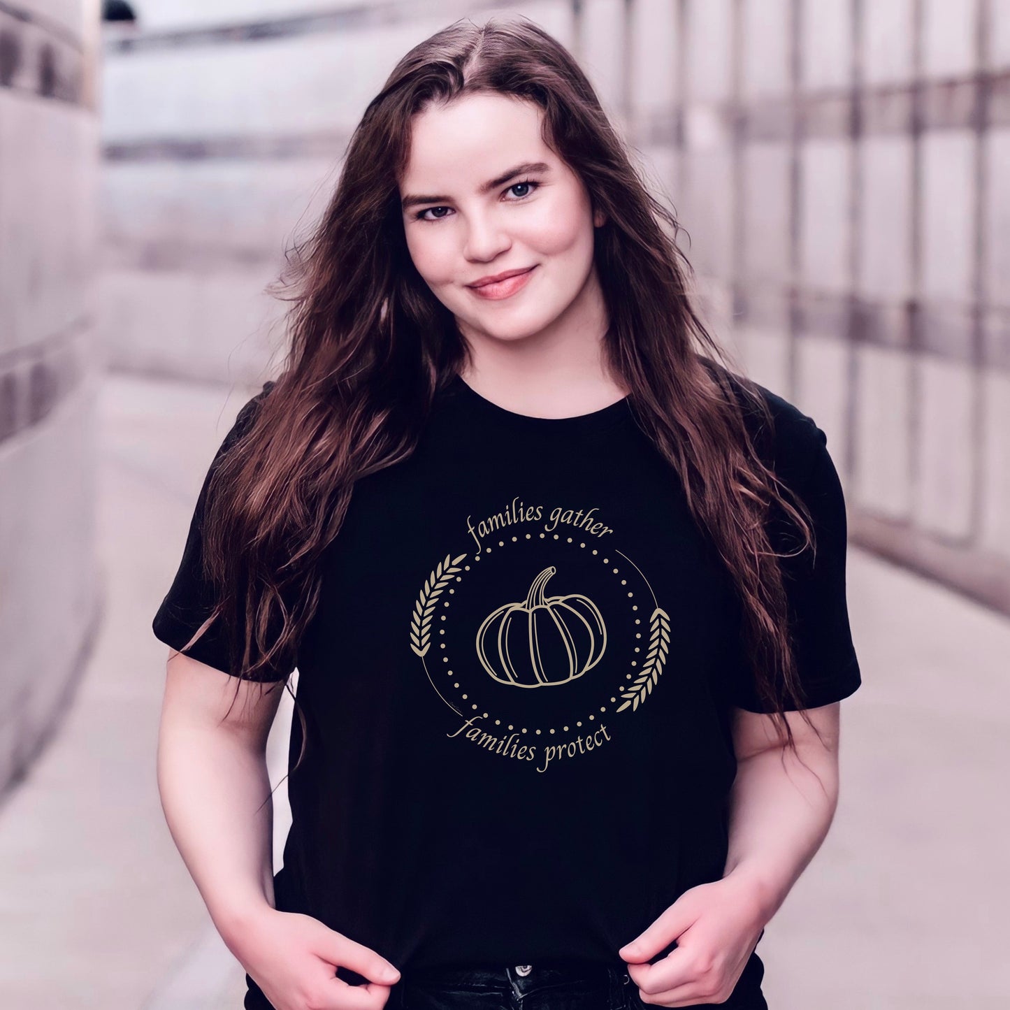Adorned with a heartwarming autumn-fall harvest pumpkin graphic and the inspiring message Families Gather, Families Protect, this White T-shirt stands as a testament to the unwavering support and protection families should offer to survivors.