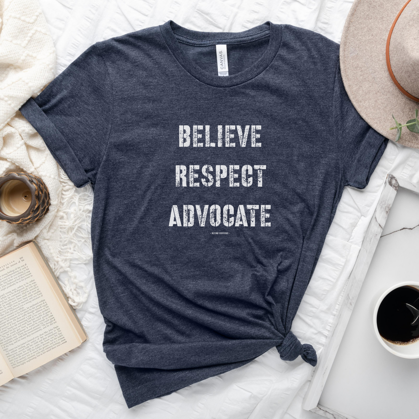 The front of this tshirt has the empowering words Believe Respect Advocate in a bold distressed font. Created for survivors of trauma and abuse, as well as mental health advocates who believe in fostering respect and supporting survivors