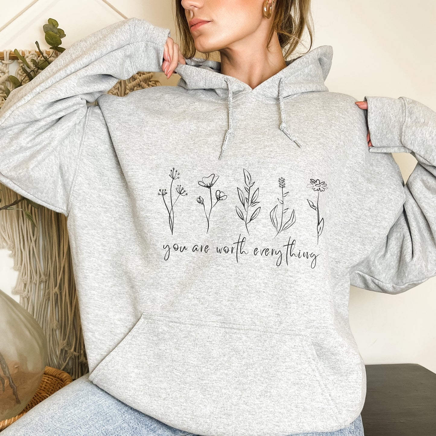 Adorned with beautiful wildflowers graphic and the empowering affirmation message You Are Worth Everything, this Tshirt is a wearable reminder of your inherent value worth and uniqueness.