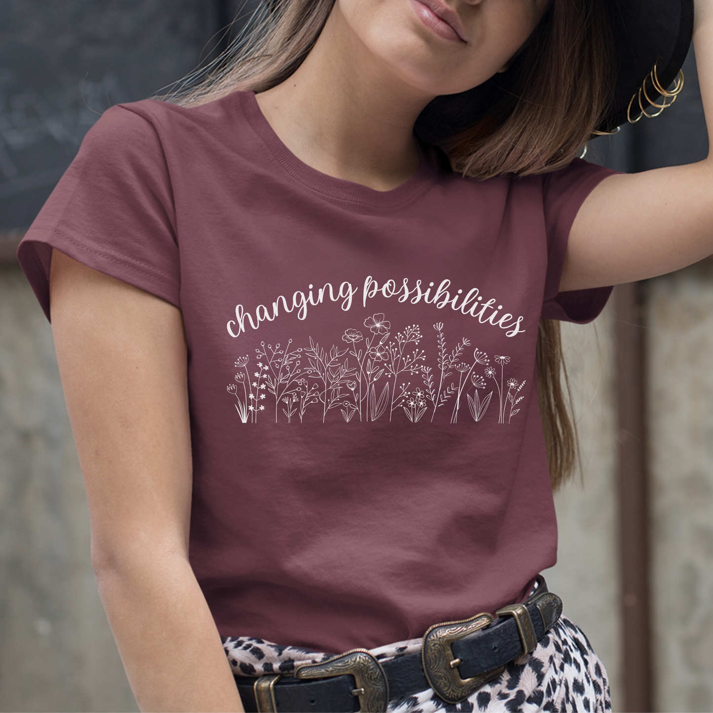 The front of this tshirt has the empowering words Changing Possibilities over a beautiful wildflower design. This tee celebrates advocates who are changing the world. Join the movement to change possibilities and create a culture of empowerment.