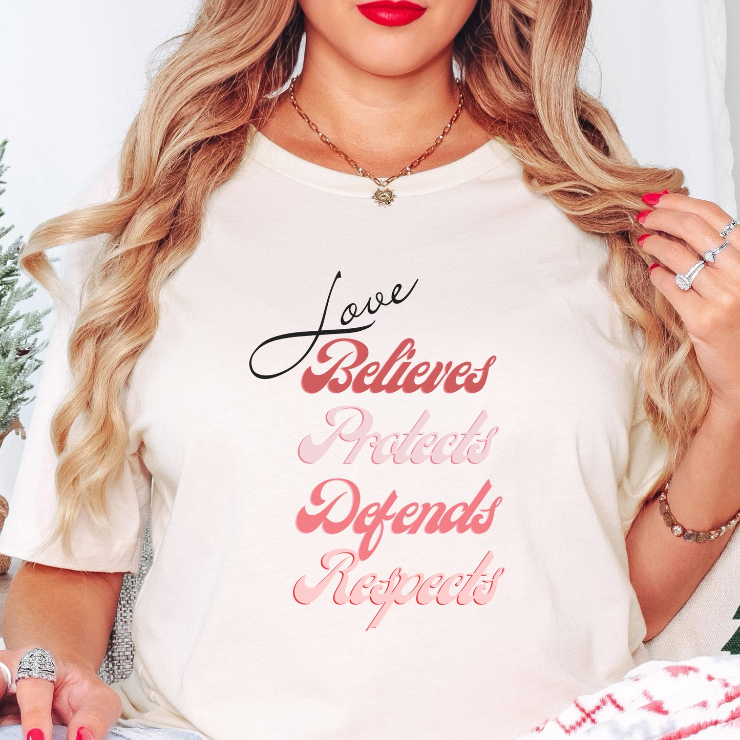 The front of this tshirt has the impactful phrase, "Love Believes Protects Defends Respects," artfully displayed in a beautiful retro font, capturing attention while spreading a message of compassion, strength, and support. Crafted with care and commitment, this tee combines a powerful message with a touch of retro elegance.