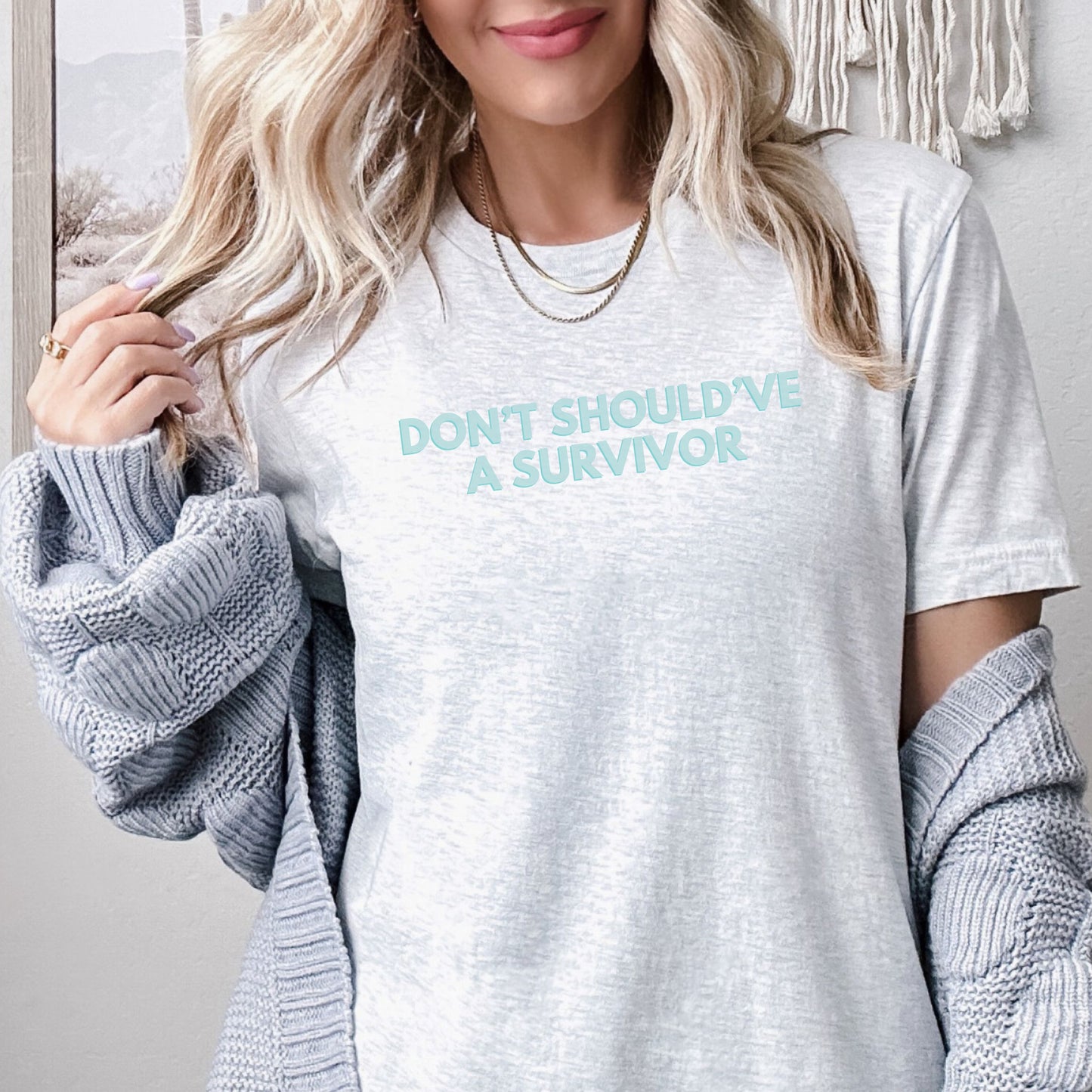 The front of the T-shirt has the empowering saying ‘Don’t Should’ve A Survivor’ and the back says Team Survivor SAAM with the teal awareness ribbon. Designed to support survivors and end victim blaming during April Sexual Assault Awareness Month (SAAM) and Denim Day. Perfect for survivors, child and victim advocates, and mental health advocates.
