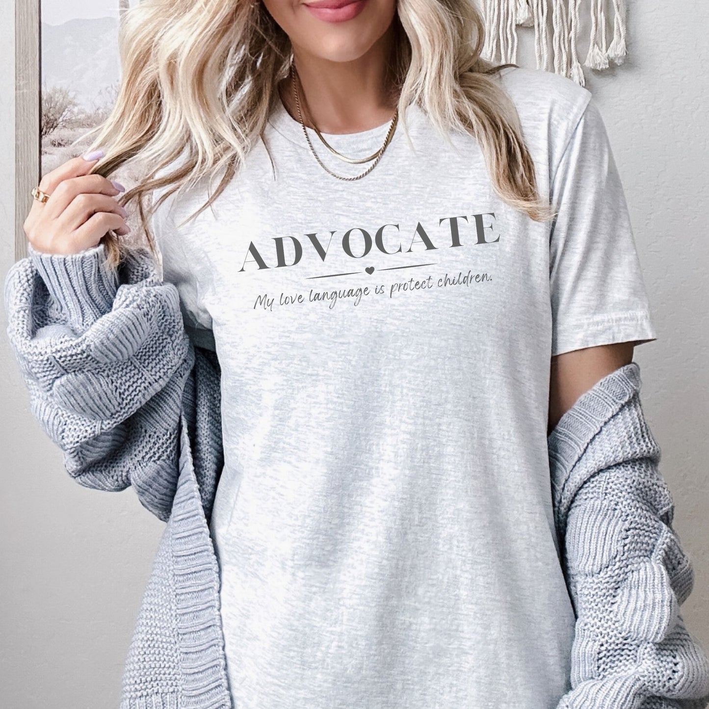 Front and center, the bold message declares, "ADVOCATE: my love language is protect children." This impactful phrase encapsulates the essence of your commitment to safeguarding children and promoting their well-being. Perfect for child advocates, champions of children’s mental health, and for Child Abuse Awareness and Prevention Month