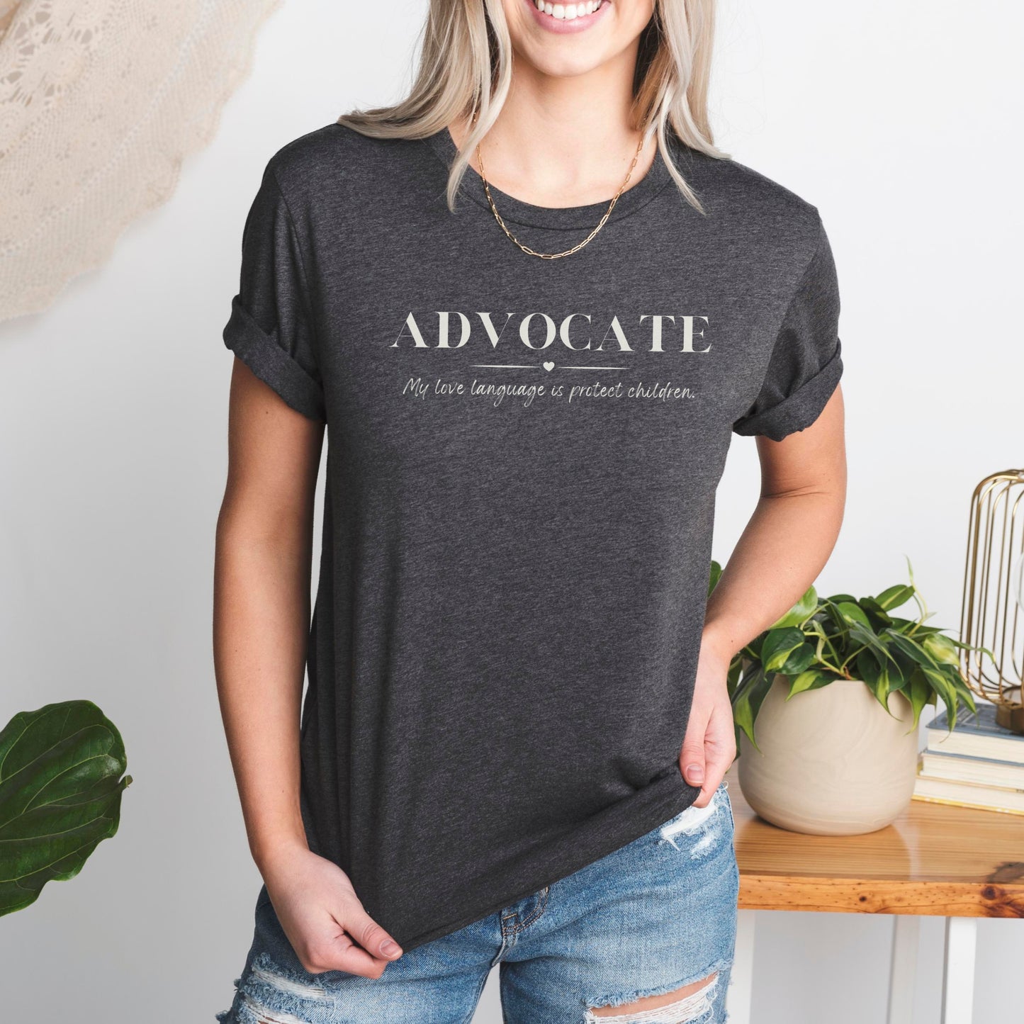 Front and center, the bold message declares, "ADVOCATE: my love language is protect children." This impactful phrase encapsulates the essence of your commitment to safeguarding children and promoting their well-being. Perfect for child advocates, champions of children’s mental health, and for Child Abuse Awareness and Prevention Month