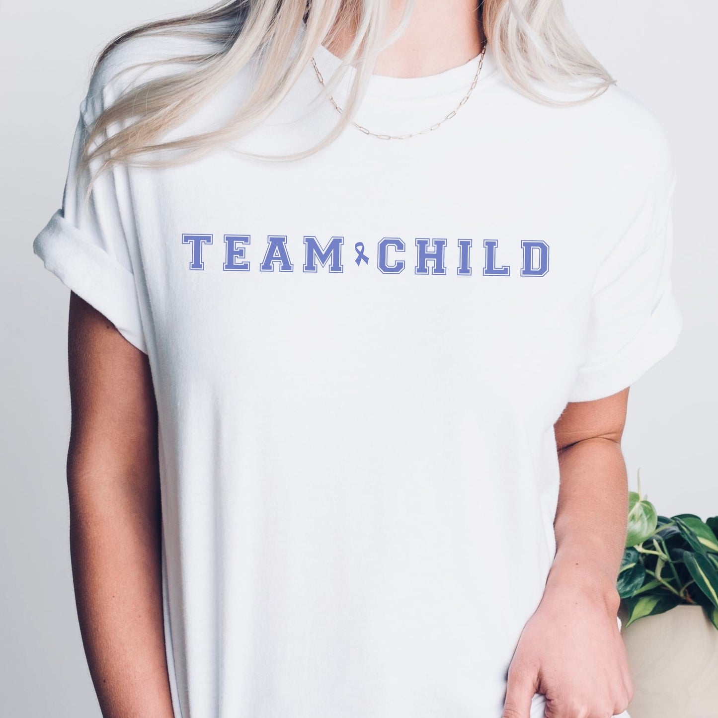 Our exclusive t-shirt has ‘Team Child’ on the front in a bold font with the blue child abuse awareness ribbon between the words. This impactful phrase encapsulates the essence of your commitment to safeguarding children and promoting their well-being. Perfect for child advocates, champions of children’s mental health, and for Child Abuse Awareness and Prevention Month (CAPM)
