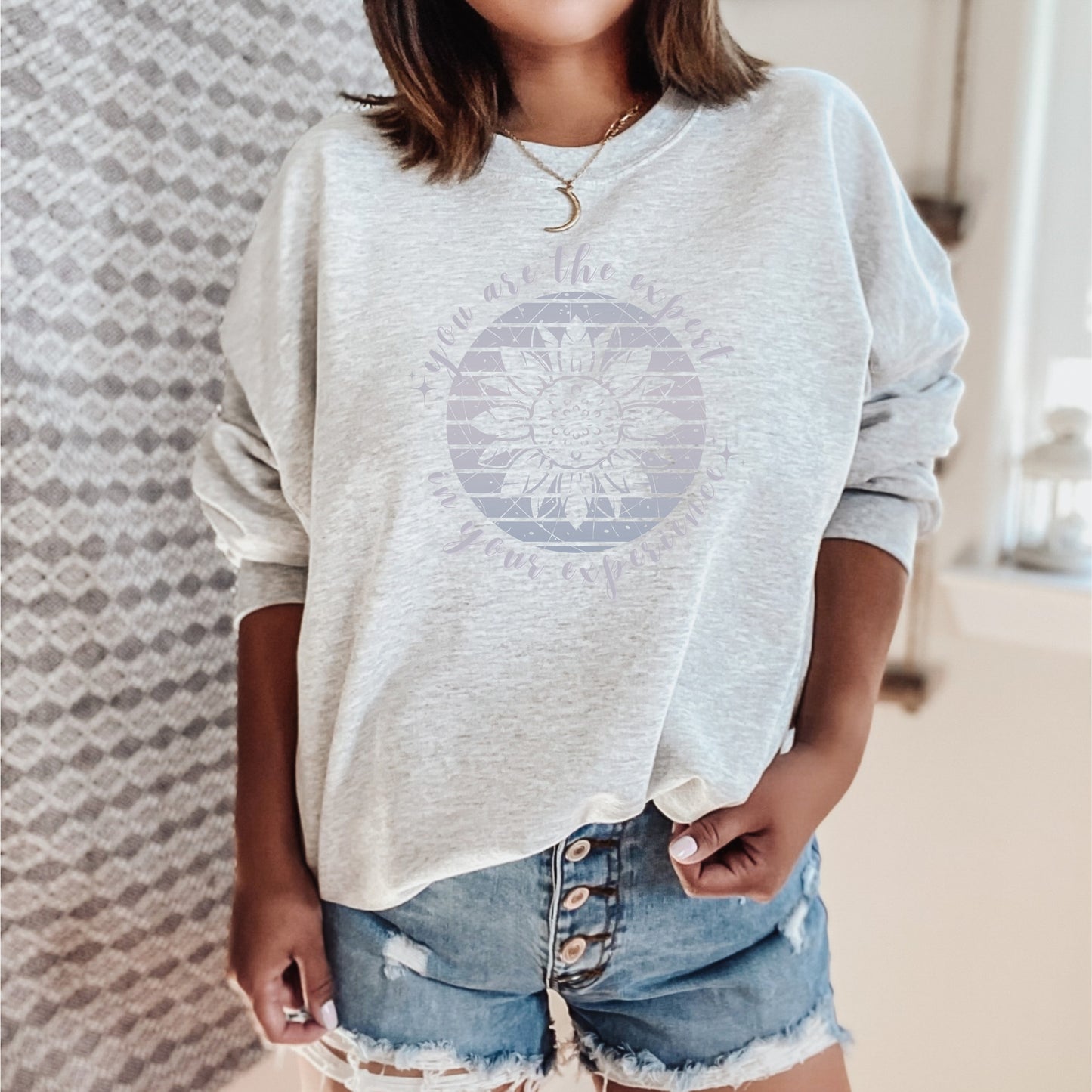 Mental health empowerment with our unique sweatshirt, tailored for survivors and advocates of abuse and trauma. The boho sunflower, a symbol of strength and growth, is surrounded by the powerful message, You are the expert in your experience.