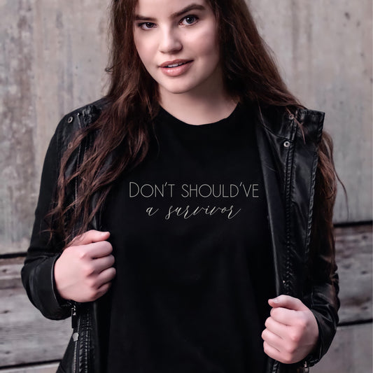 The bold and impactful slogan, "Don't Should've A Survivor," sends a clear message against the harmful practice of victim blaming. By wearing this shirt, you become an advocate for change, contributing to a culture of empathy, understanding, and respect. Perfect for survivors of abuse and trauma, victim advocates, and mental health advocates.