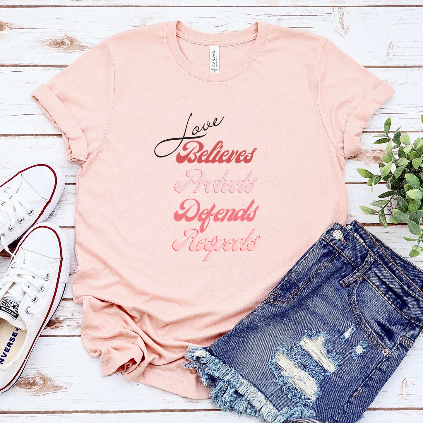 The front of this tshirt has the impactful phrase, "Love Believes Protects Defends Respects," artfully displayed in a beautiful retro font, capturing attention while spreading a message of compassion, strength, and support. Crafted with care and commitment, this tee combines a powerful message with a touch of retro elegance.