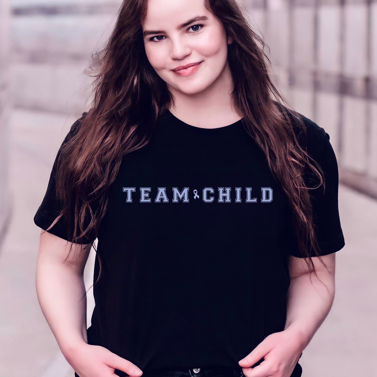 Our exclusive t-shirt has ‘Team Child’ on the front in a bold font with the blue child abuse awareness ribbon between the words. This impactful phrase encapsulates the essence of your commitment to safeguarding children and promoting their well-being. Perfect for child advocates, champions of children’s mental health, and for Child Abuse Awareness and Prevention Month (CAPM)