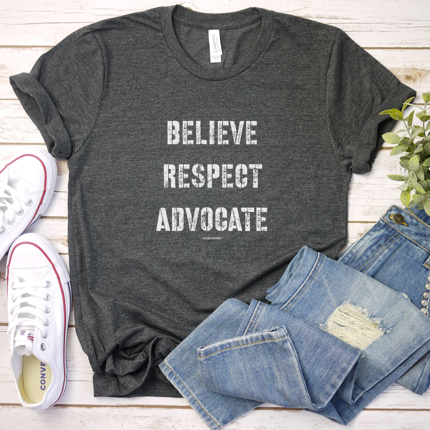  The front of this tshirt has the empowering words Believe Respect Advocate in a bold distressed font. Created for survivors of trauma and abuse, as well as mental health advocates who believe in fostering respect and supporting survivors