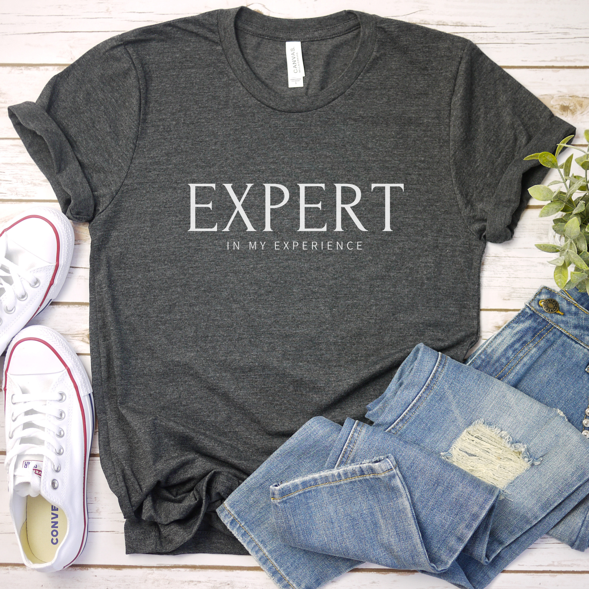 Expert in My Experience t-shirt in dark grey heather with white print. Soft unisex empowerment tee for mental health awareness and advocacy.