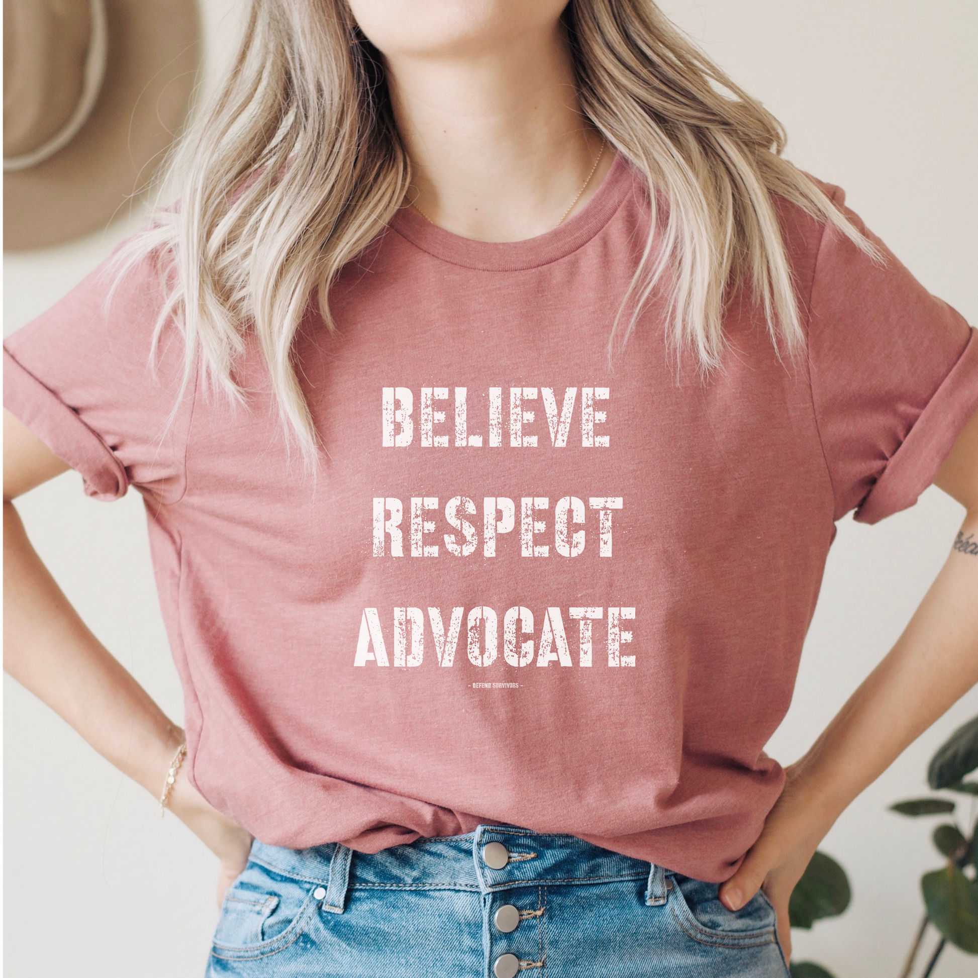  The front of this tshirt has the empowering words Believe Respect Advocate in a bold distressed font. Created for survivors of trauma and abuse, as well as mental health advocates who believe in fostering respect and supporting survivors