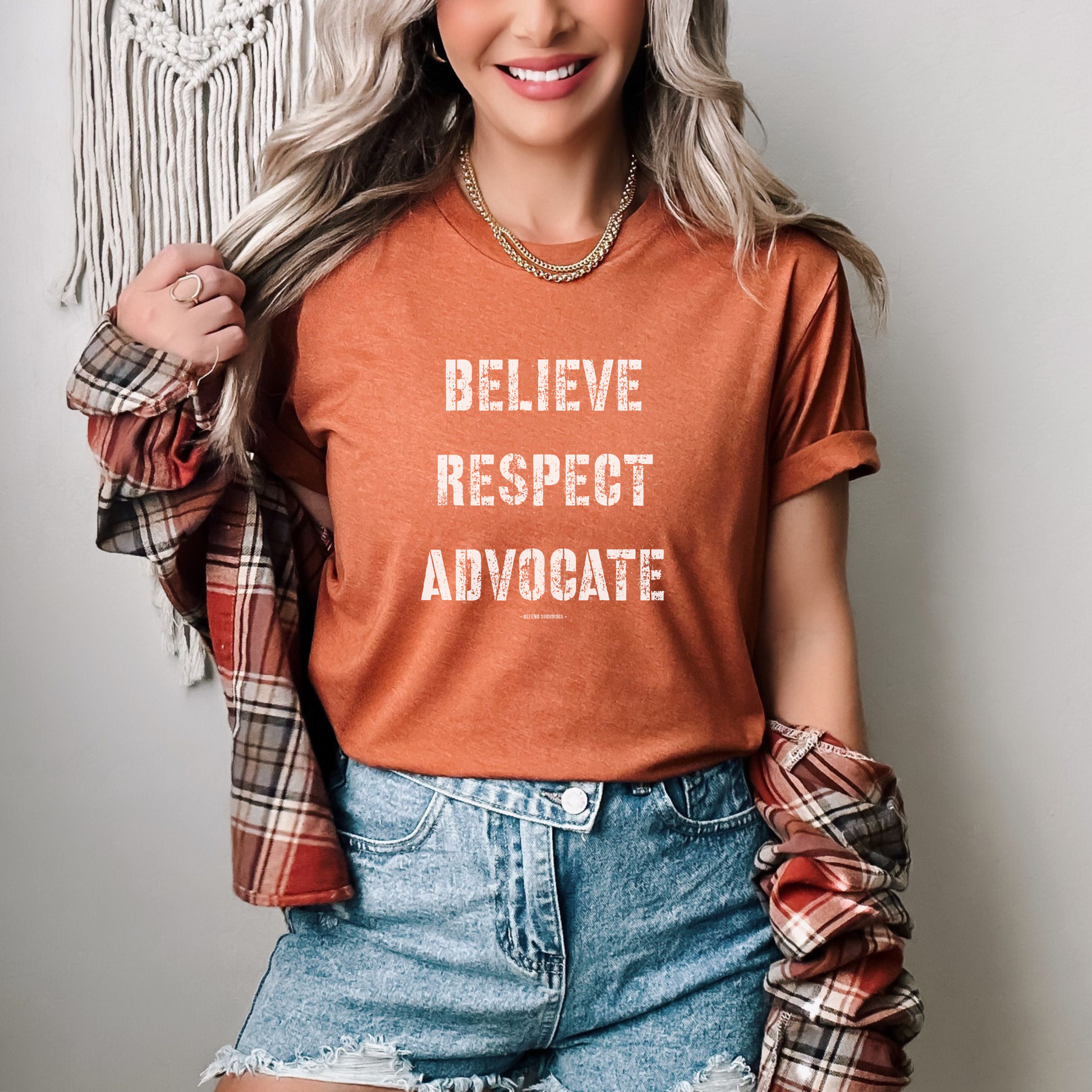  The front of this tshirt has the empowering words Believe Respect Advocate in a bold distressed font. Created for survivors of trauma and abuse, as well as mental health advocates who believe in fostering respect and supporting survivors