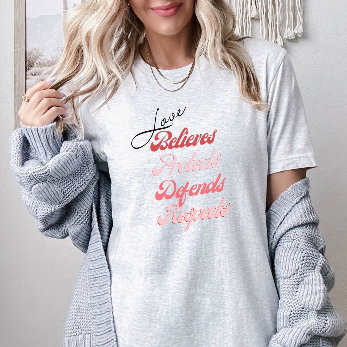 The front of this tshirt has the impactful phrase, "Love Believes Protects Defends Respects," artfully displayed in a beautiful retro font, capturing attention while spreading a message of compassion, strength, and support. Crafted with care and commitment, this tee combines a powerful message with a touch of retro elegance.