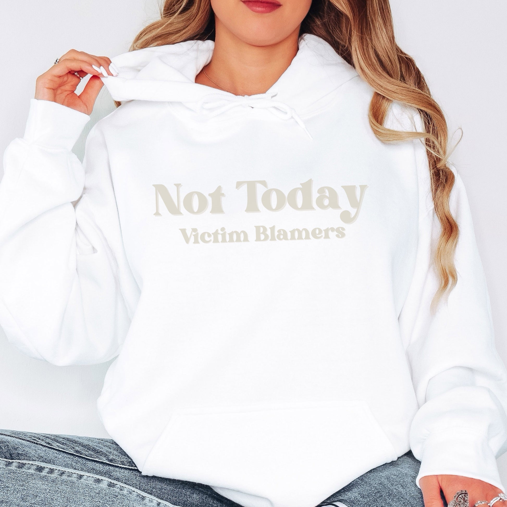 The front of the hooded sweatshirt proudly displays the phrase Not Today Victim Blamers in a bold and eye catching font. This message serves as a reminder that we reject victim blaming and support those who have faced injustice.