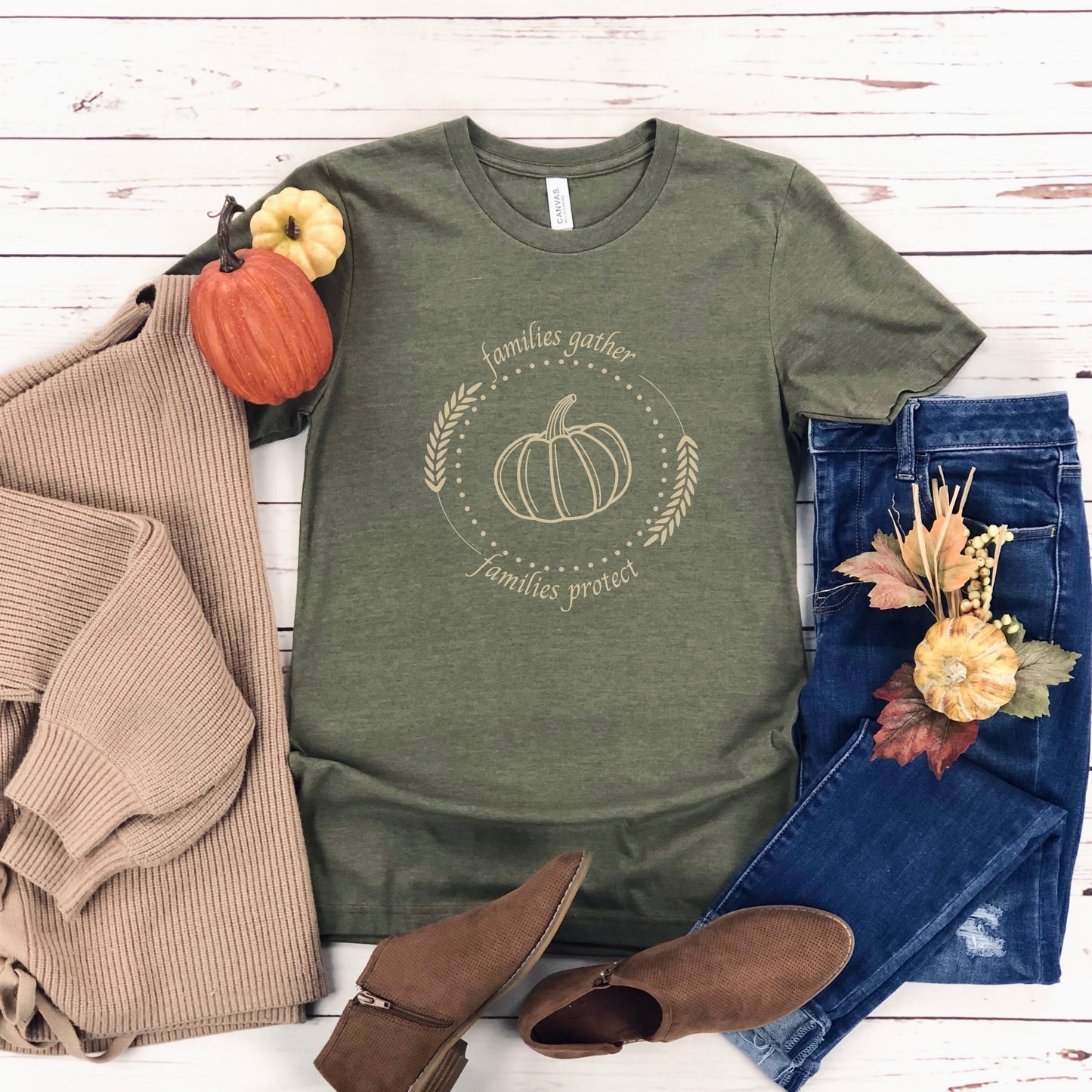Adorned with a heartwarming autumn-fall harvest pumpkin graphic and the inspiring message Families Gather, Families Protect, this White T-shirt stands as a testament to the unwavering support and protection families should offer to survivors.