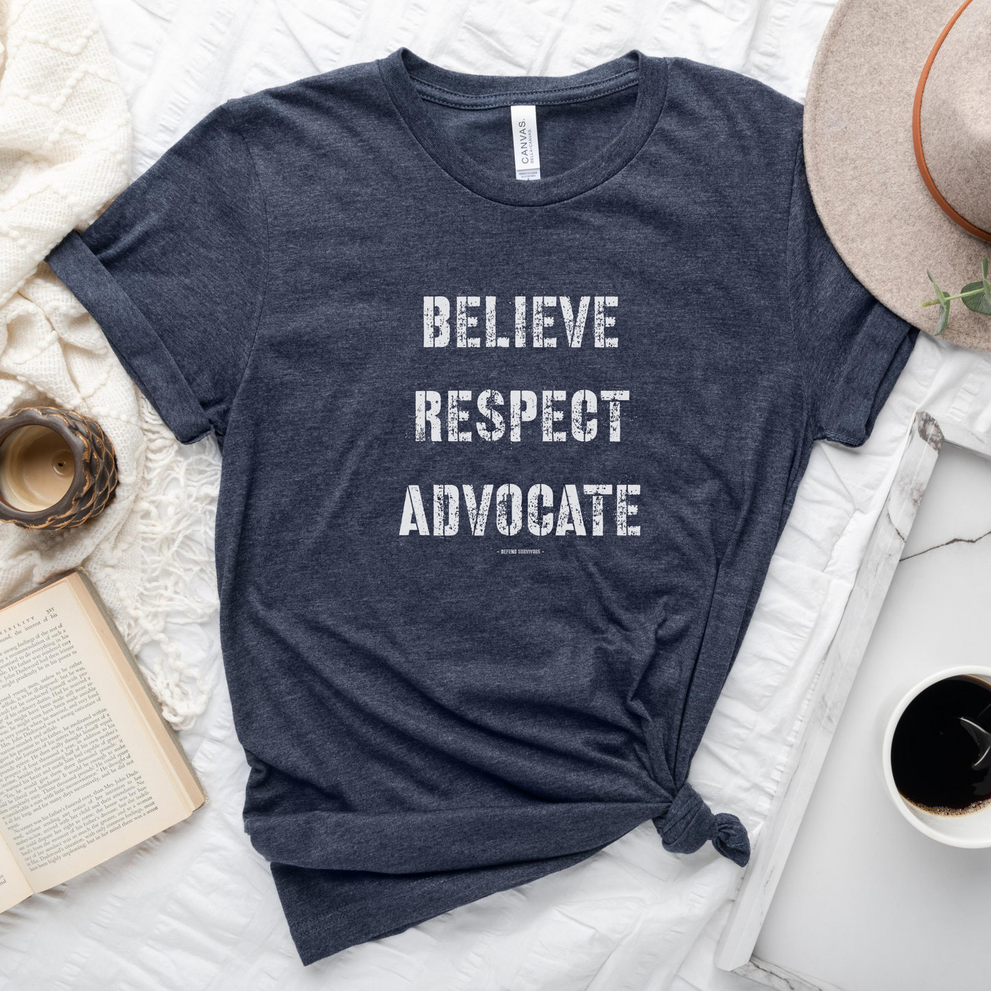  The front of this tshirt has the empowering words Believe Respect Advocate in a bold distressed font. Created for survivors of trauma and abuse, as well as mental health advocates who believe in fostering respect and supporting survivors