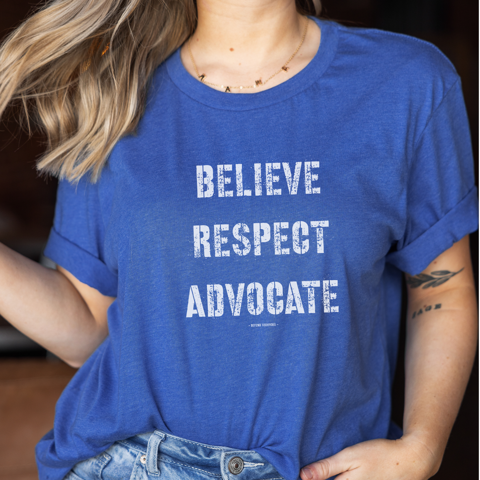  The front of this tshirt has the empowering words Believe Respect Advocate in a bold distressed font. Created for survivors of trauma and abuse, as well as mental health advocates who believe in fostering respect and supporting survivors