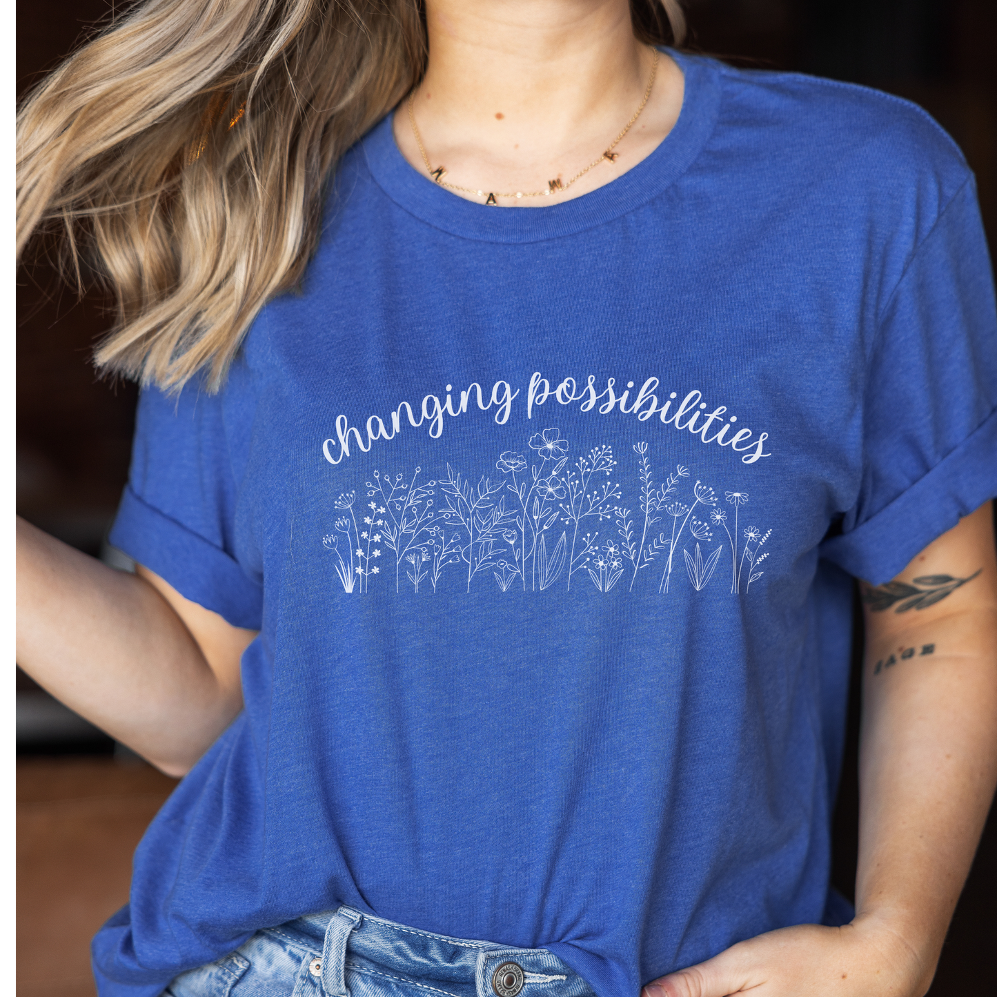 The front of this tshirt has the empowering words Changing Possibilities over a beautiful wildflower design. This tee celebrates advocates who are changing the world. Join the movement to change possibilities and create a culture of empowerment.